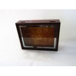 A late 19th century cigar case, the mahogany box with glazed top with silvered border