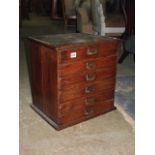 An Edwardian oak nest of six index filing drawers