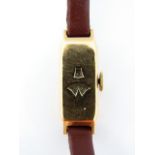 A lady's 18ct gold digital read wristwatch, the dials with Arabic numerals, on a later brown leather