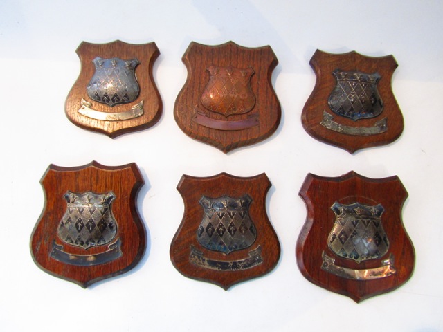 A collection of five silver-mounted wooden trophy plaques, Vaughton & Sons, Birmingham, 1937 - 1938,