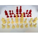 A complete 19th century turned ivory chess set, with well formed pieces, half red stained, set