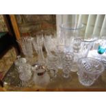 A mixed collection of clear cut glass to include various vases, heavy clear cut wine glasses, a