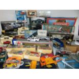 A quantity of boxed die cast model vehicles to include examples by Burago, other examples by Corgi