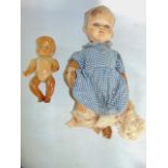 A vintage Pedigree doll together with one other