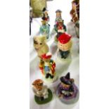 A collection of nine Wade figures including Town Crier Catkin, Little Miss Muffet, Humpty Dumpty,