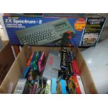 A boxed ZX Spectrum + 2 console a boxed Atari 2600 console and a boxed original Gameboy together