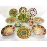 A collection of 19th century Imari wares including a pair of dessert plates with pierced borders,