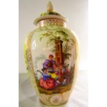 A 19th century continental vase and cover with alternating panels incorporating flowers on a