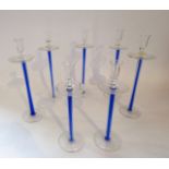 Five 20th century/contemporary glass candle stands, each with clear glass bowls and rims set above