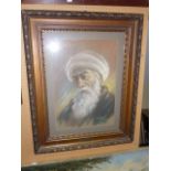 An early 20th century pastel study bust length portrait of an elderly bearded man wearing a