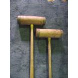 Two vintage wooden croquet mallets with brass rings