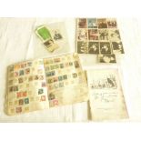 A French exercise book containing a collection of stamps from Madagascar, Martinique, etc, a