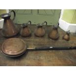 A graduated collection of five 19th century copper measures, the largest of 2 gallon capacity, the