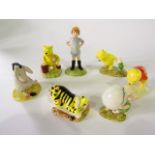 A collection of Royal Doulton figures from the Winnie the Pooh collection comprising Christopher