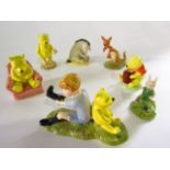 A collection of Royal Doulton figures from the Winnie the Pooh collection comprising Christopher