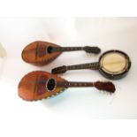 Two antique mandolins, each with tortoiseshell, mother of pearl and other inlay, with bone pegs