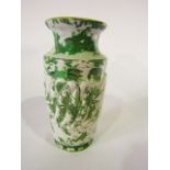 A 19th century vase of wrythen moulded form and with printed and infilled chinoiserie dragon