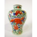 A 19th century oriental vase of shouldered form with painted trailing floral and lion decoration