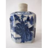 An early 19th century oriental blue and white caddy of square cut form with canted corners and