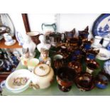 A quantity of royal commemorative related wares including a pair of jugs modelled as King George V