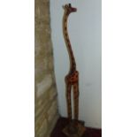 A carved timber model of a giraffe, 132 cm tall approx