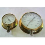 A German-made brass cased pressure gauge, marked Schaffer & Budenberg, together with a smaller