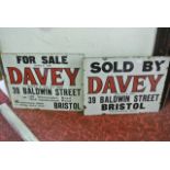 Two associated 20th century enamelled wall hanging advertising plaques, both with a white ground