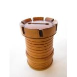 A 19th century boxwood castellated tower money box 8 cm high