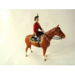 A Beswick equestrian figure of Her Majesty Queen Elizabeth II mounted in Imperial trooping the