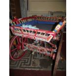 A vintage Eastern European folk art dog cart, with brightly hand-painted finish, sprung chassis,