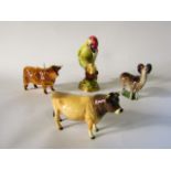 A collection of Beswick figures, including a green woodpecker marked to base 1218, a model of a