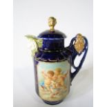 An early 20th century Vienna type blue ground chocolate/coffee pot and cover, with moulded and