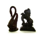 A 19th century cast iron door stop in the form of a rampant lion raised on a stepped rectangular