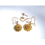 A pair of Victorian style earrings, each suspended with a circular motif with engraved border,