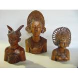 A trio of detailed shoulder length eastern carved figures, the tallest 32 cm tall approx