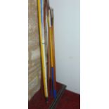 A collection of approximately nine 20th century reproduction jousting javelins, varying in height