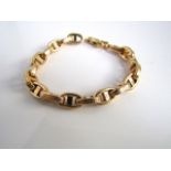 A 9ct gold Gucci-link bracelet, each link with Greek Key decoration, 10.2g