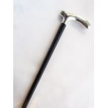 A slender ebony walking cane terminating in a silver handle with Birmingham marks (rubbed)