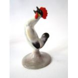 An unusual Royal Doulton model of a crowing cockerel in predominantly grey glaze with red comb and