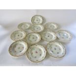 A set of eleven late 19th century continental Meissen type side plates, with painted floral