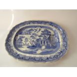 A large 19th century blue and white meat plate of oval form with well, with printed mark to