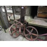 A set of four vintage cast iron chicken house spoke wheels