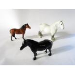 Three Beswick models of horses, comprising: a grey shire, a New Forest pony and a Dales pony