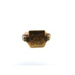 A 9ct gold signet ring, with shaped shoulders and monogram, size W 1/2, 8g