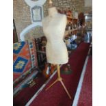 A tall circa mid-20th century tailor's dummy/mannequin, the stitched female form with stencilled