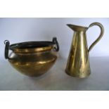 A brass ewer and a 19th century Eastern brass bowl with ring handles