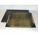 Two leather clad blotter pads, one measuring 50 x 70 cm approx, the other measuring 45 x 62 cm