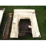 A pair of late Victorian cast iron fire places/inserts with foliate detail and stepped surrounds (