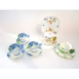 A collection of Art Deco tea wares comprising a Royal Albert Buttercup pattern trio with butterfly