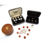 A cased mother-of-pearl and pearl dress set, comprising: buttons, cufflinks and shirt studs, in